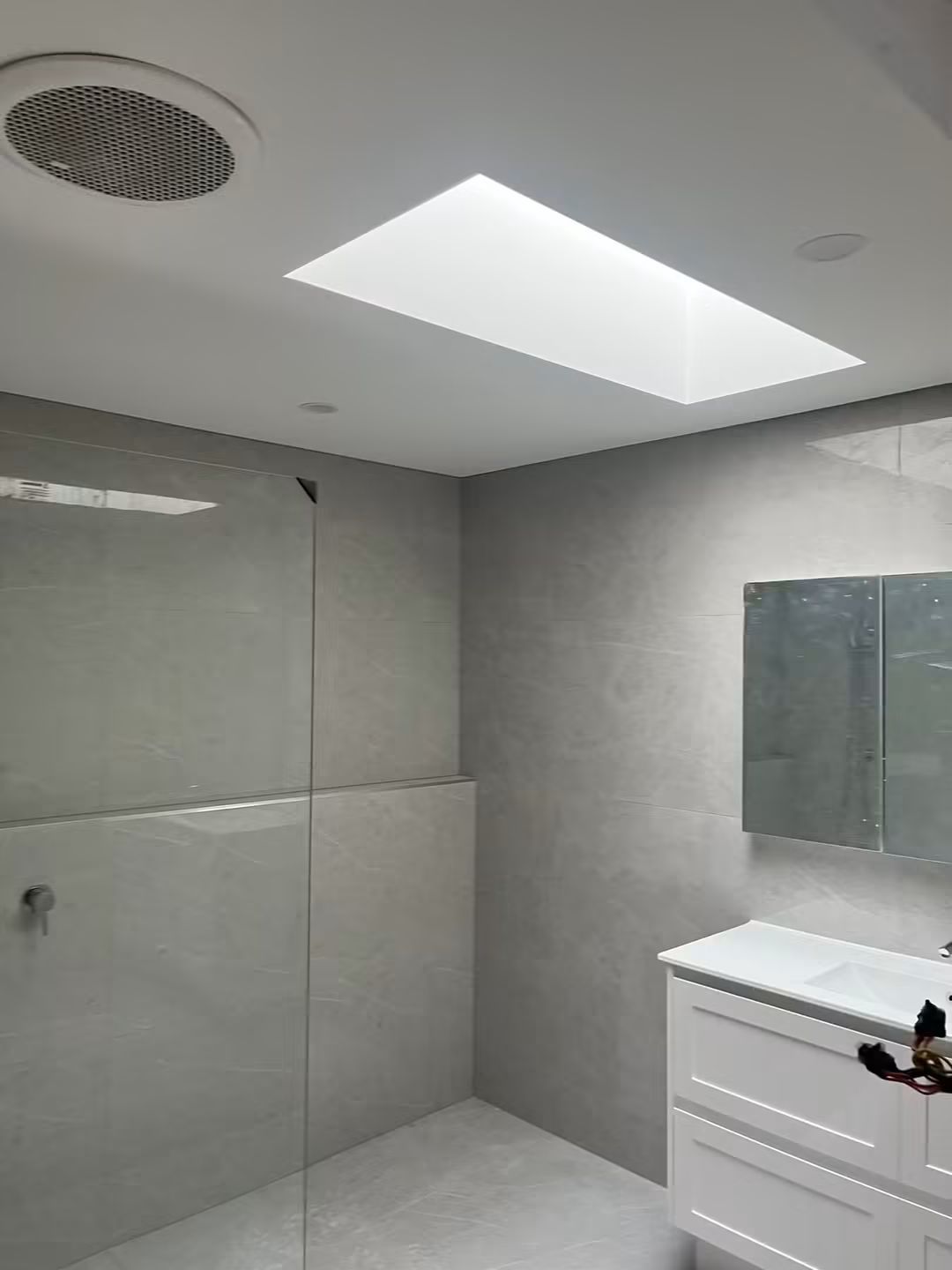 Skylight above a modern bathroom vanity