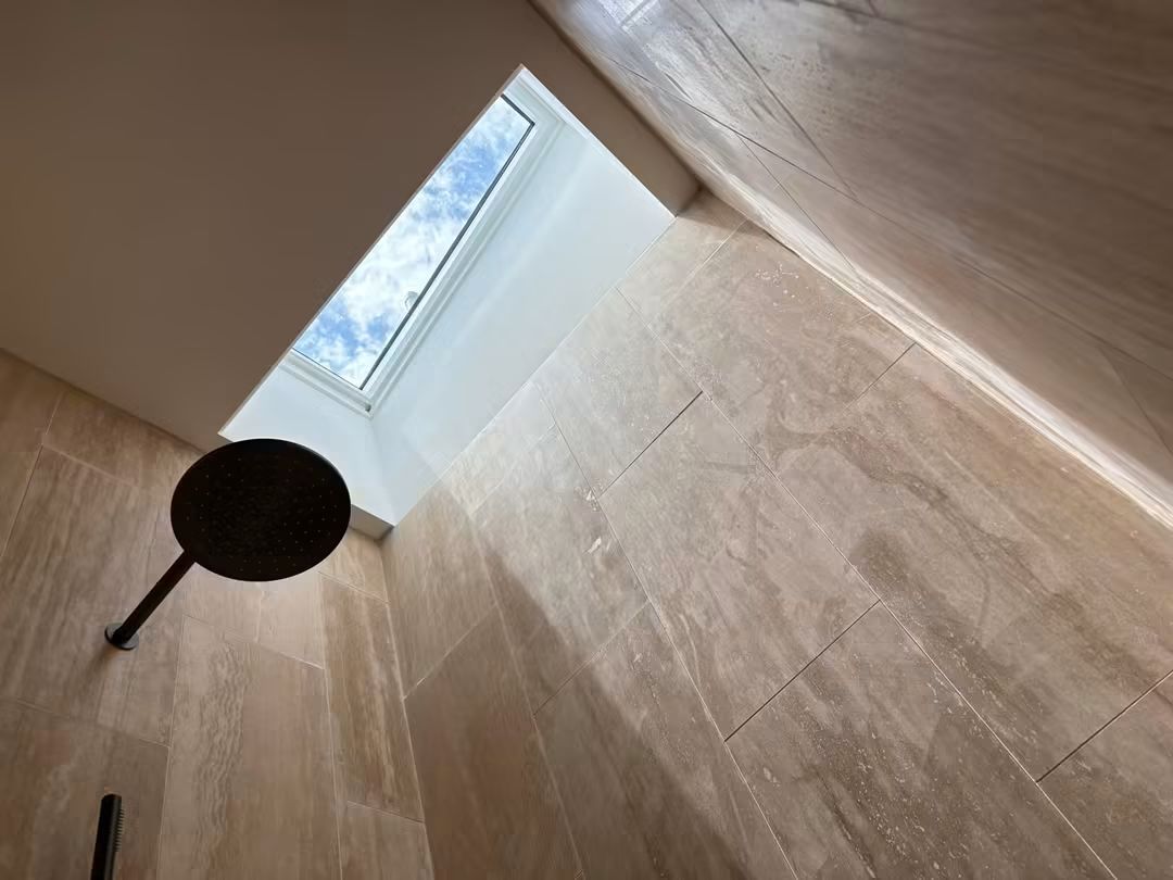 Skylight lighting a tiled shower