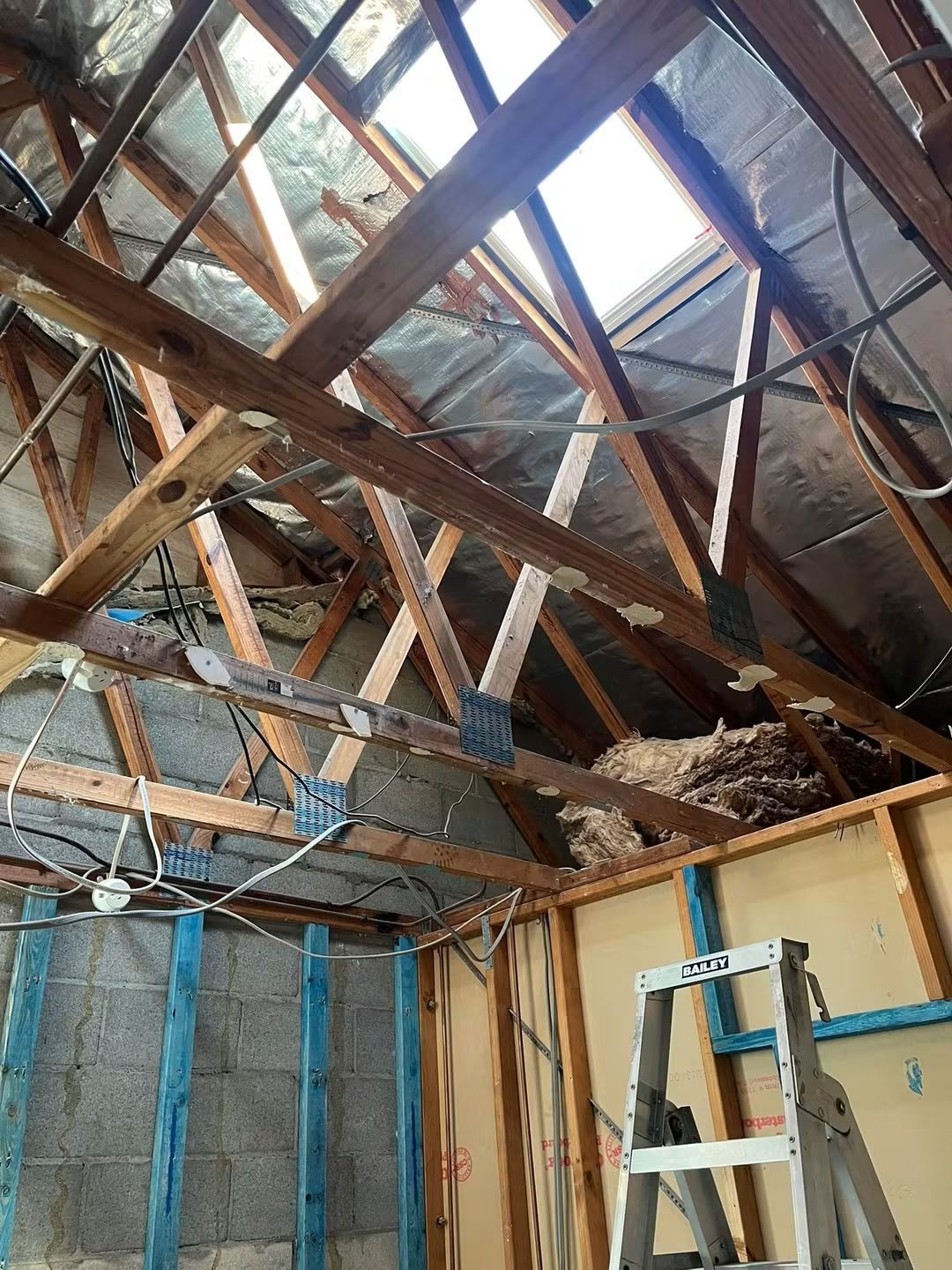 Working inside the roof cavity above the ceiling