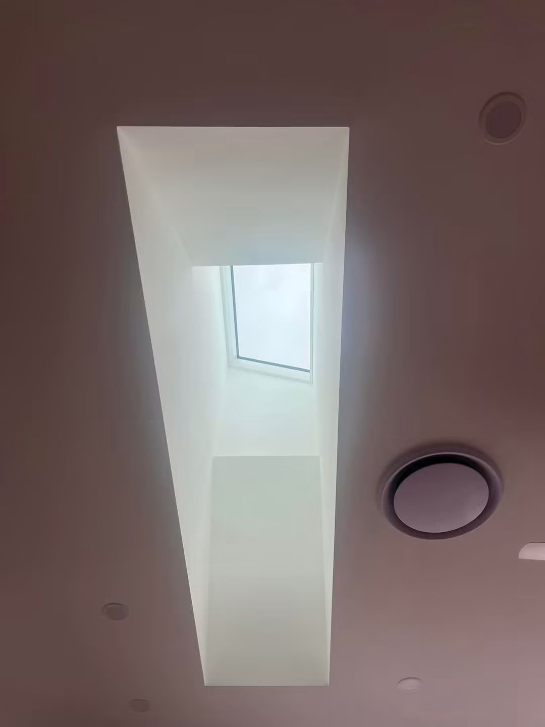 Long skylight shaft down a hallway ceiling