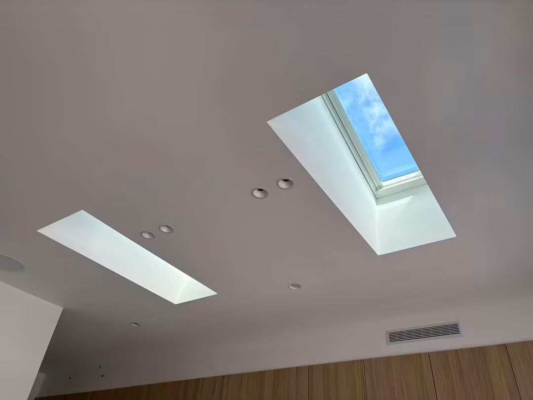 Two skylights in a modern flat ceiling