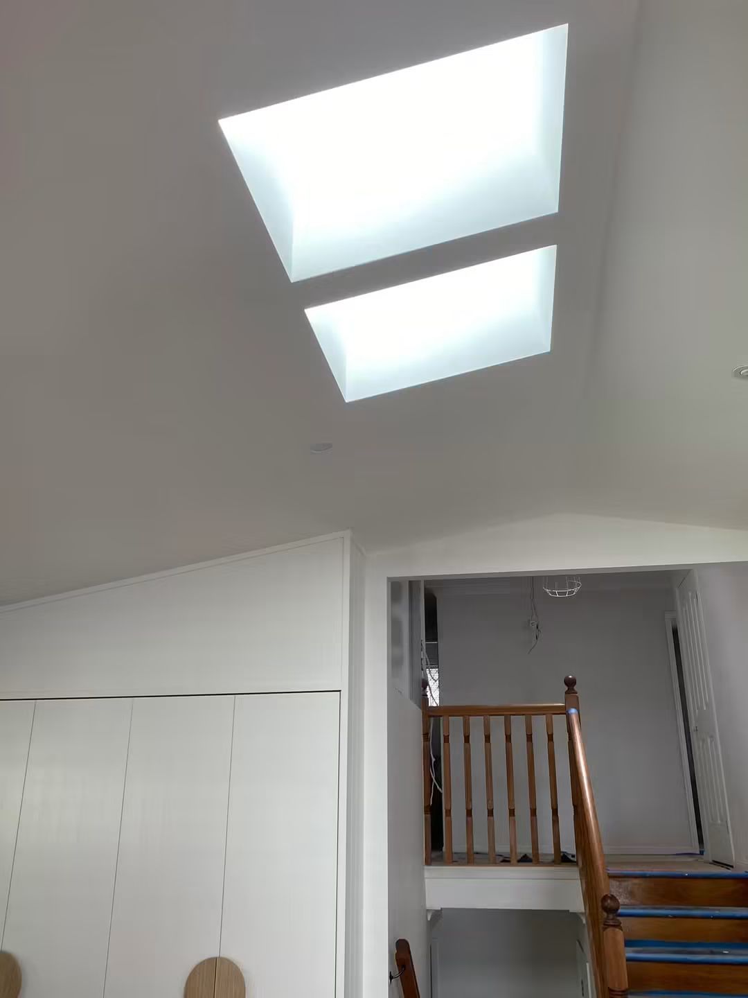 Two skylights above a staircase