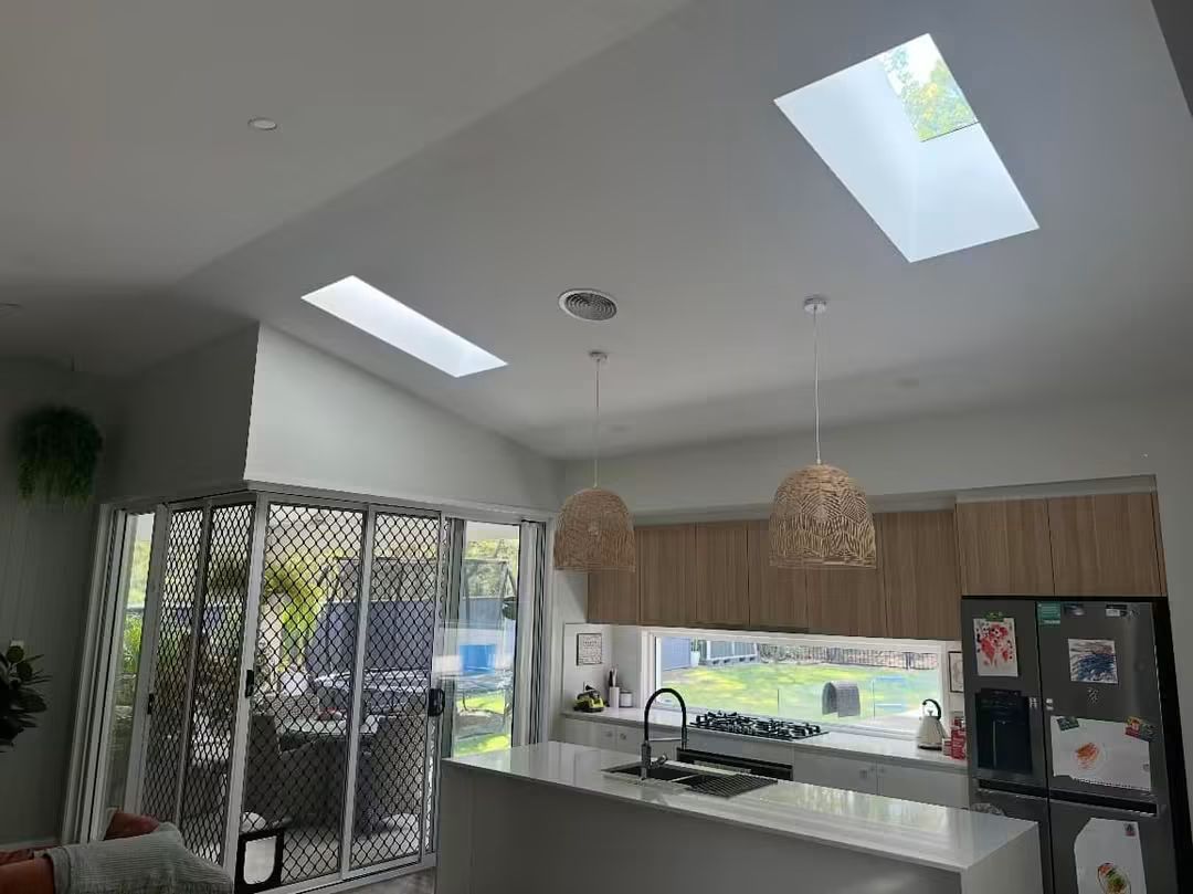 Skylights above a kitchen with pendant lights