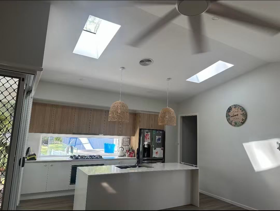 Two skylights lighting a kitchen bench