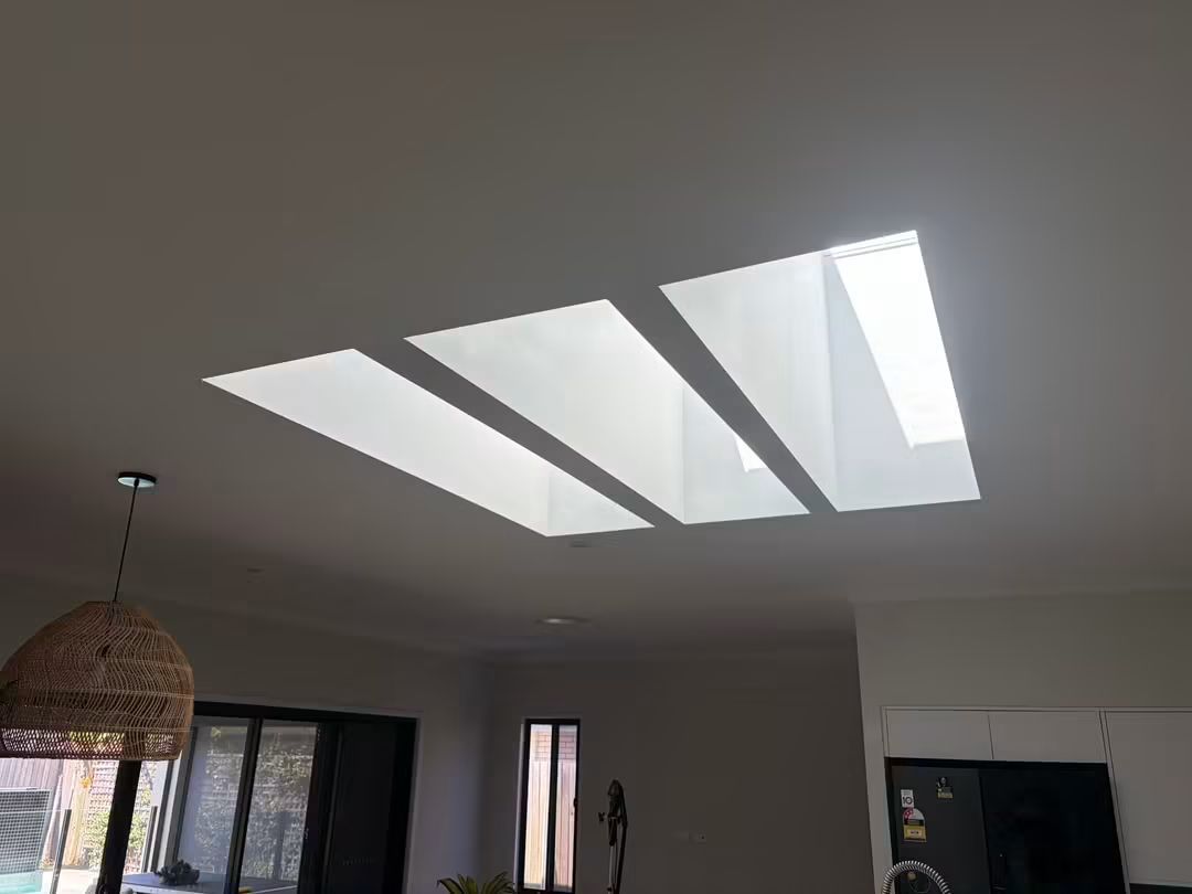 Long banked skylights in a modern ceiling