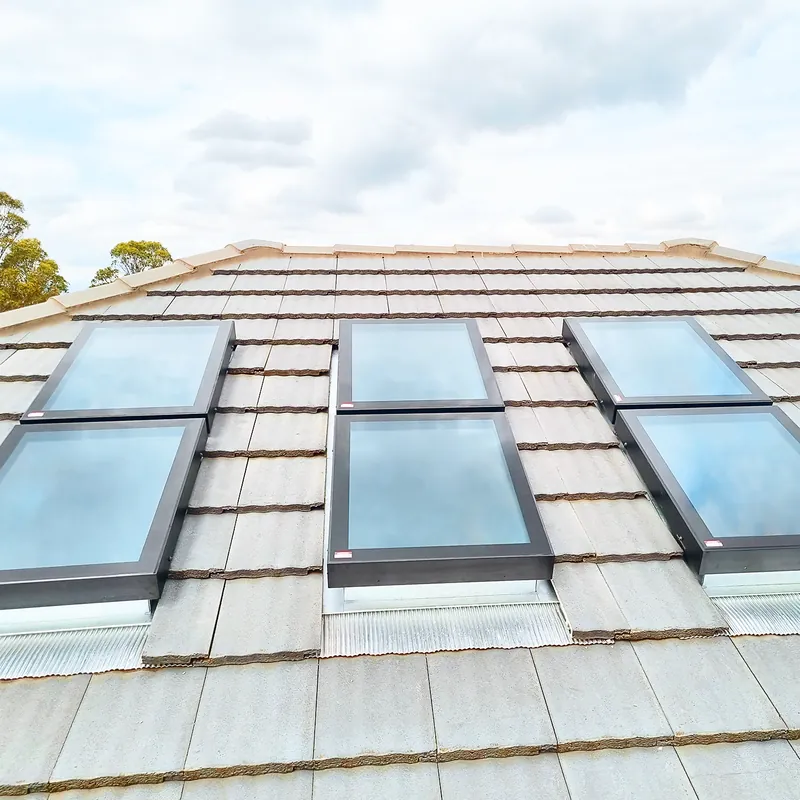 INFINITI fixed skylights on a tiled roof