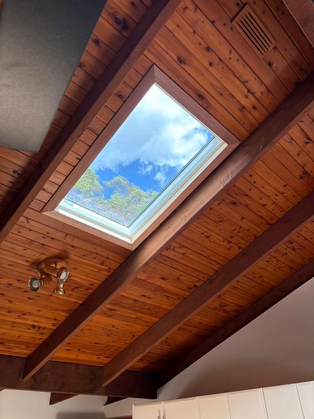 Skylight set between exposed timber beams