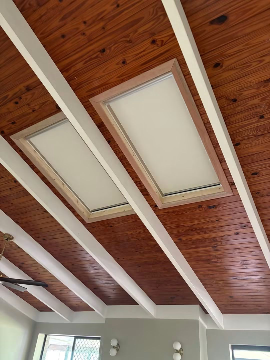 Obscured skylight in a timber raked ceiling