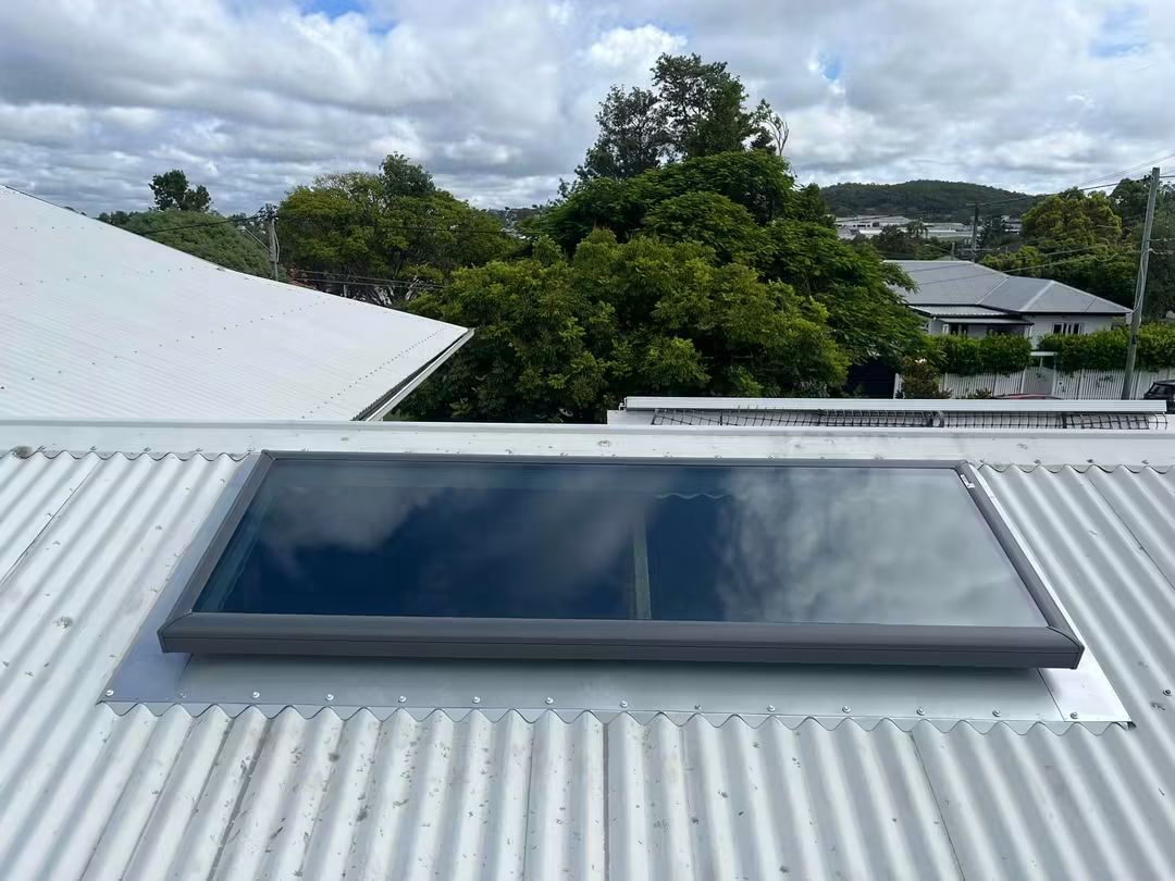 Large tinted skylight on a corrugated metal roof